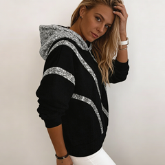 Laza fazonú női kapucnis pulóver flitteres díszítéssel – kényelmes, divatos, könnyen kombinálható