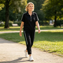 Costum Sport Casual din 2 Piese pentru Femei - Tricou cu Fermoar și Guler Polo, Pantaloni Lungi cu Dungi Laterale, Material Moale și Elastic de Vară