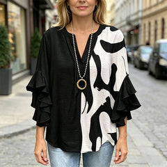 Bluză Elegantă cu Imprimeu Floral și Volane – Un Look Rafinat și Feminin în Orice Moment